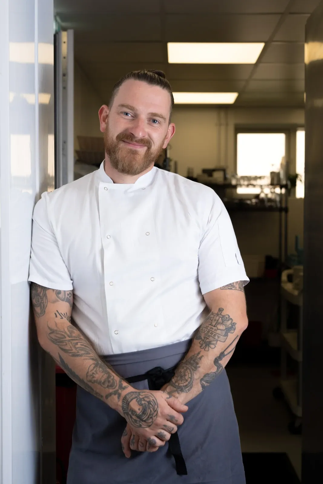 Johnny Varah a Devon chef stands in his kitchen