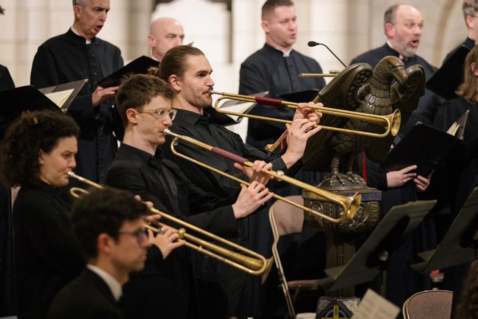 Musicians play fanfare trumpets