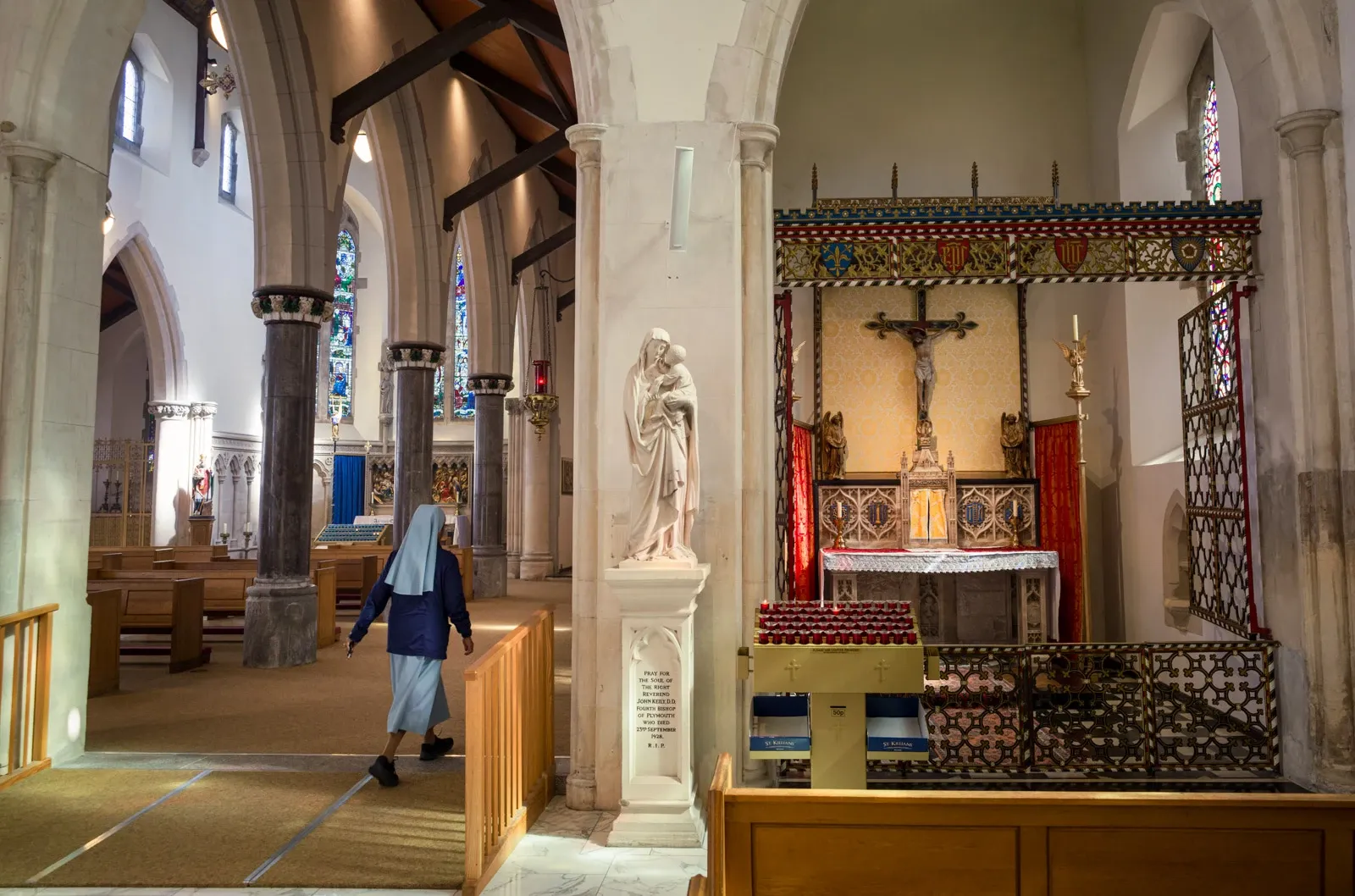 A nun walks past the Blessed Sacrament chapel of Plymouth Cathedral