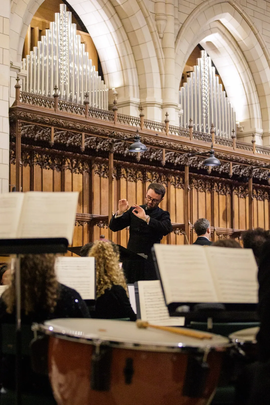 Matthew Searles conducts a choir