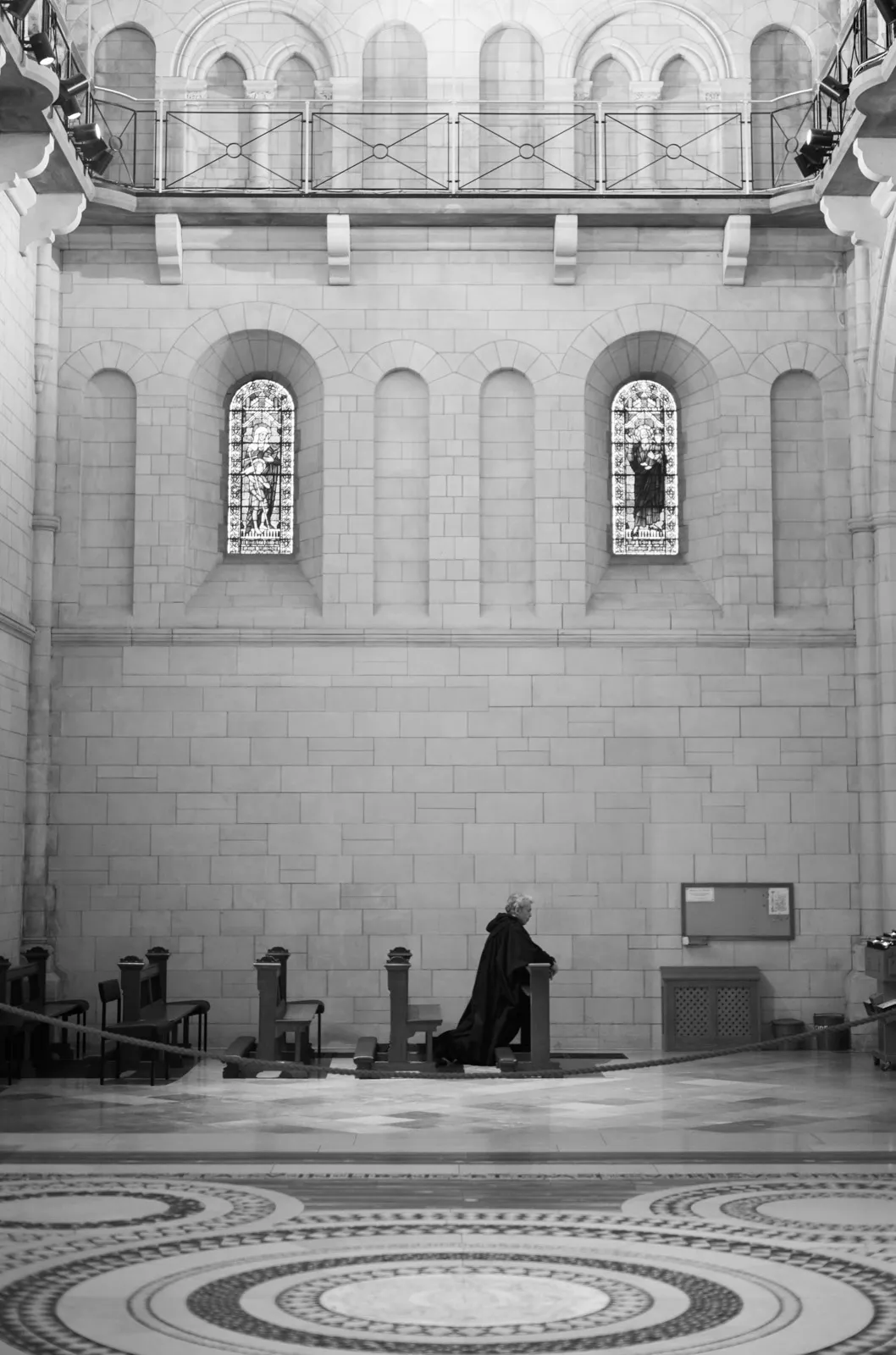 A monk kneels in prayer inside the Lady Chapel of Buckfast Abbey