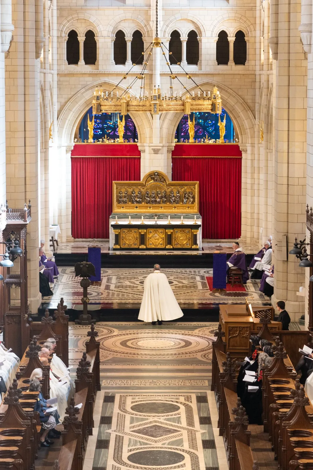 A Knight of the Holy Sepulchre approaches the altar of Buckfast Abbey