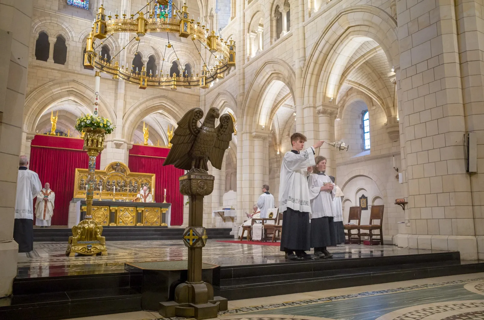 A thurifer incenses the congregation at Buckfast Abbey